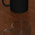 Black Ceramic Mug And Clear Glass Cup On Wooden Table