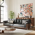 Black Leather Sectional Sofa with Black White Pillows Modern Living Room Abstract Painting Green Plant