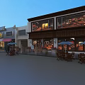 Charming Commercial Street With Red Brick Buildings Red Awnings Outdoor Seating And Wooden Deck