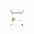 Stylish Gold Metal Frame Dining Table With Glassware Decanter Metal Cups And Books