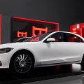 White Sedan Showcased In Modern Exhibition Space With Red Illumination