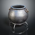 Metallic Cauldron With Three Legs And Brass Handles On Black Reflective Surface