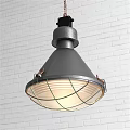 Gray Metal Pendant Light With Wire Mesh Shade Against White Brick Wall