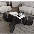 Modern White Sofa And Black Coffee Table Set With Open Book On Gray Rug