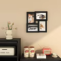 Decorative Black Photo Frames Arranged On Beige Wall With Vase Flowers Vintage Radio And Cabinet