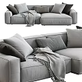 Cozy Modern Gray Two Seater Sofa With Plush Pillows And Soft Blanket