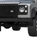 Silver Land Rover Defender 4x4 SUV With Large Tires And Modern Design