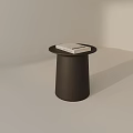 Black Cylindrical Side Table with White Book on Round Top in Light Interior 3d model