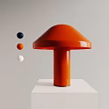 Orange Mushroom Shaped Table Lamp On White Pedestal With Blue Orange White Small Balls