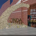 Floral Archway Event Entrance With CINDA CENTER Sign And Red Brick Wall