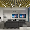 Modern Showroom Interior With White Tables TV Screens Sofa And Yellow Ceiling