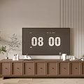 Modern Brown TV Stand with Multiple Drawers Green Plant and Decorative Items