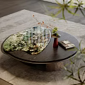 Modern Round Coffee Table With Green Pattern Top Red Vase Book And Plants On Rug