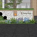 Textured Stone Feature Wall With Green Plants Flowers And Modern Building Entrance