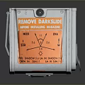 Silver Square Electronic Device With Orange Model 5 Label And Interface Knob