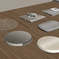 Various Floor Cushions In Round Square Shapes With Woven Fabric On Wooden Floor