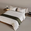 Modern Single Bed With White Sheets Green Blanket Bedside Tables Table Lamps And Alarm Clocks