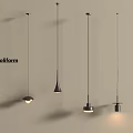 Poliform Modern Pendant Lights With Various Designs And Warm Lighting Hanging On Beige Wall