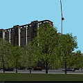 Modern Multi Story Residential Building Surrounded By Green Trees And Parking Lot Near Roads