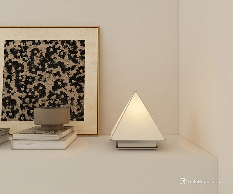 Triangular Table Lamp On Light Colored Shelf With Golden Framed Artwork And Stack Of Books 3d model