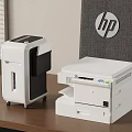HP Office Appliances Including Multifunction Printer And Shredder On Wooden Desk