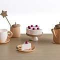 Assorted Table Items With Star Wooden Spoon Jar Cup Saucer Cake And Teapot
