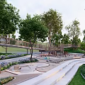 Lush Park Landscape With Winding Paths Trees Flower Beds Green Lawn And Wooden Playground
