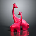 Two Shiny Red Giraffe Figurines On Dark Background For Decorative