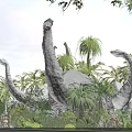 Giant Reptile Dinosaur Models In Tropical Park With Palm Trees And Sunset Sky