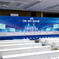 Banquet Hall for Summit Event with Stage Banner Seats Arrangement and Ceiling Lighting