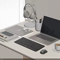 Modern Laptop Workspace Setup With Tablet Keyboard Mouse Headphones Pens And Coffee Cup