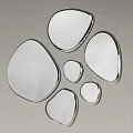 Irregular Shaped Mirrors with Silver Frames Mounted on Light Colored Wall as Modern Decor 3d model