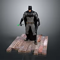 Batman in Gray and Black Suit with Cape Standing on Wooden Platform Holding Green Gadget