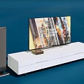 White TV Stand With Storage Drawers Holding Flat Screen TV And Speakers