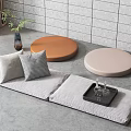 Modern Indoor Floor Seating With Gray Cushions Pillows Round Tables And Green Plant