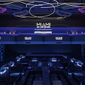 Vibrant Miami Bar Interior With LED Lighting Stage And Seating Areas