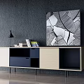 Modern TV Stand With Beige Blue Black Storage Cabinets Abstract Painting Table Lamp And Books