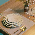 White Scalloped Dinnerware Set with Stacked Plates Cutlery Wine Glasses Linen Placemat on Wooden Table