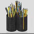 Vibrant Colored Pencils Neatly Stored In Two Black Woven Pencil Holders