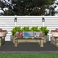 Cozy Wooden Outdoor Sofa Set With Coffee Table Plants And Lanterns In Patio Garden