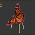 Butterfly Shaped Chair With Orange Black Wings And Metal Legs Design