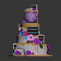 Layered Celebration Cake Decorated With Purple Blue Pink Flowers And Golden Details With Small Cake