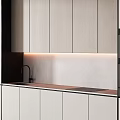 Modern Kitchen Cabinets With White Panels Black Frames Built in Oven And Countertop Lighting