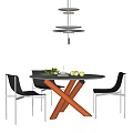 Modern Round Dining Table Set With Orange Legs And Black Chairs With Silver Metal Legs