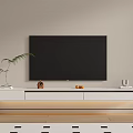 Modern White Wall Mounted TV Stand With TV Decorations And Green Plant