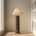 Modern Floor Lamp With Pleated Lampshade And Stacked Wooden Rings In Neutral Interior