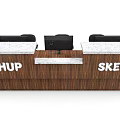 Modern Reception Desk with Wooden Front and White Countertop Featuring Black Computer and Sketchup Logo