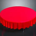 Round Dining Table With Red Tablecloth Pleated Edges And Metal Legs On Dark Background