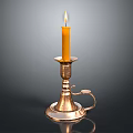 Antique Brass Candle Lamp With Lit Yellow Candle And Decorative Reflective Base