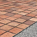 Road Infrastructure With Interlocking Brick Pavement Durable Design And Gravel Edge Details